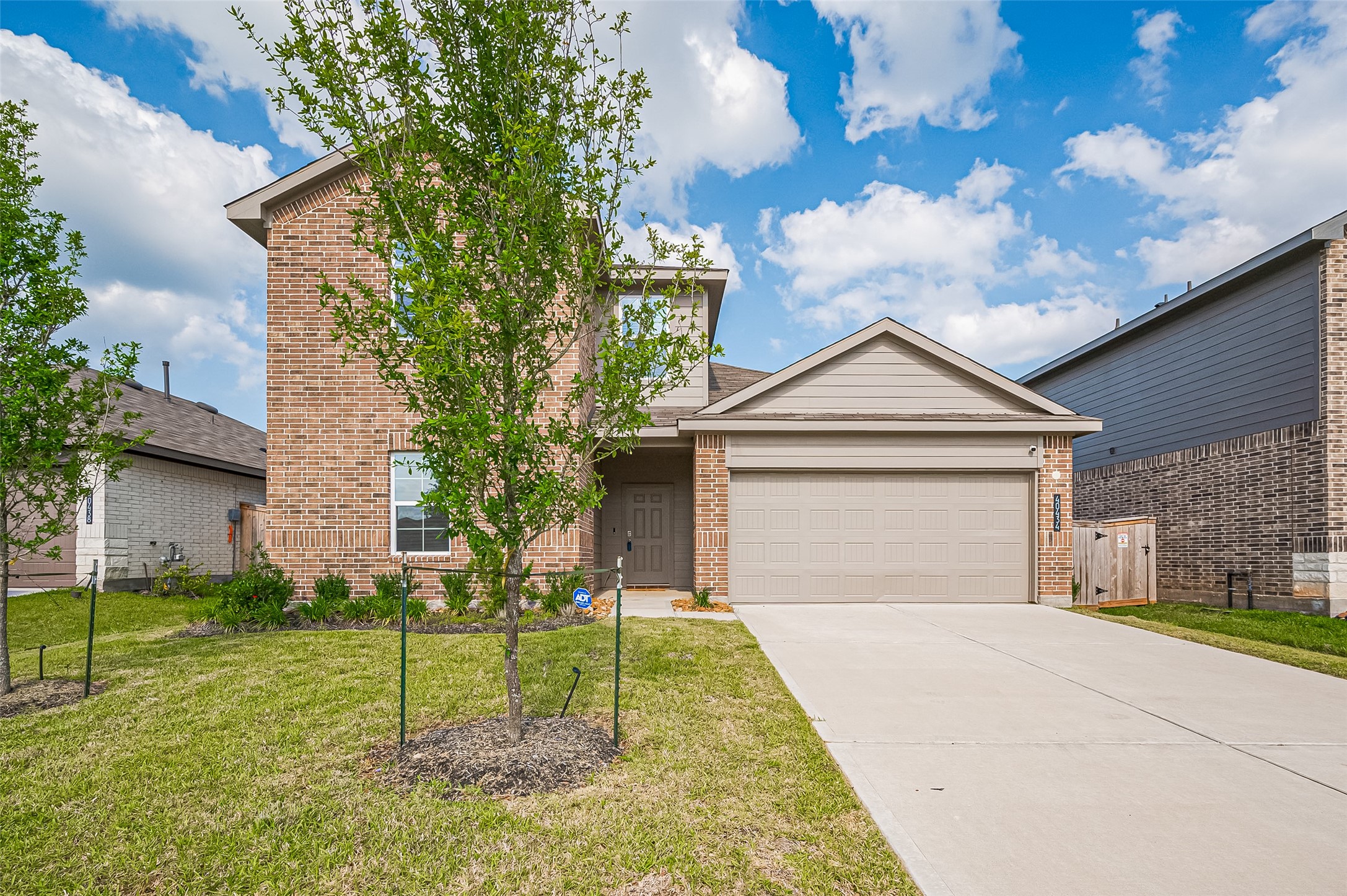 40434 Basalt Elm Road Magnolia, TX 77354 - Photo 2 of 41 a front view of a house with a yard and garage