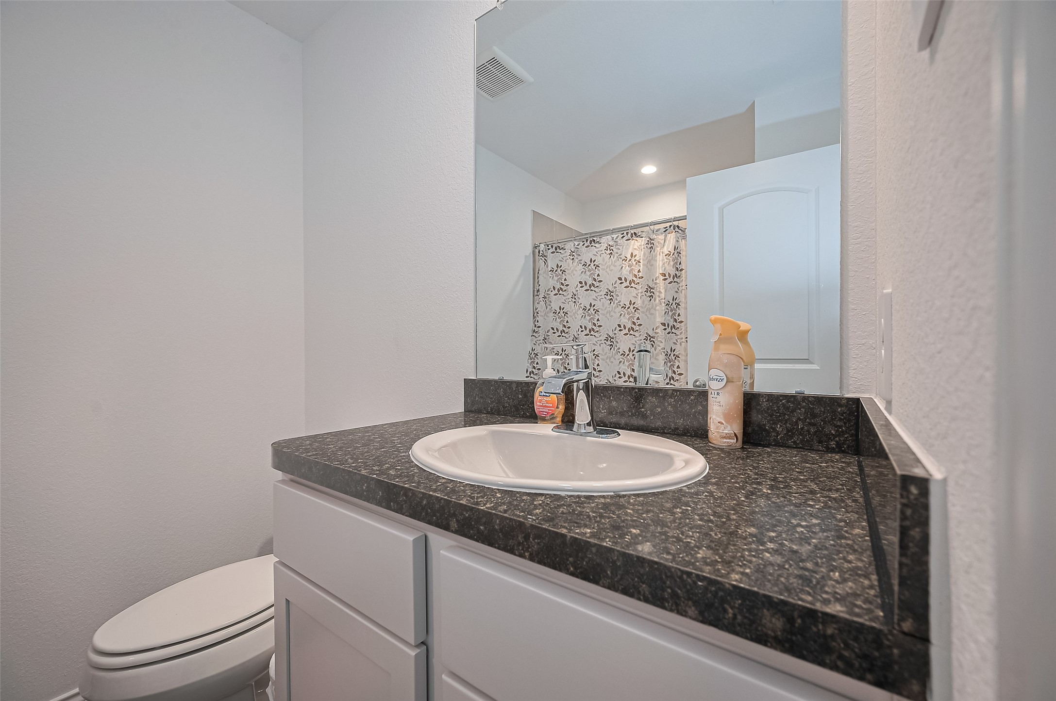 40434 Basalt Elm Road Magnolia, TX 77354 - Photo 30 of 41 a bathroom with a granite countertop sink a toilet and a mirror