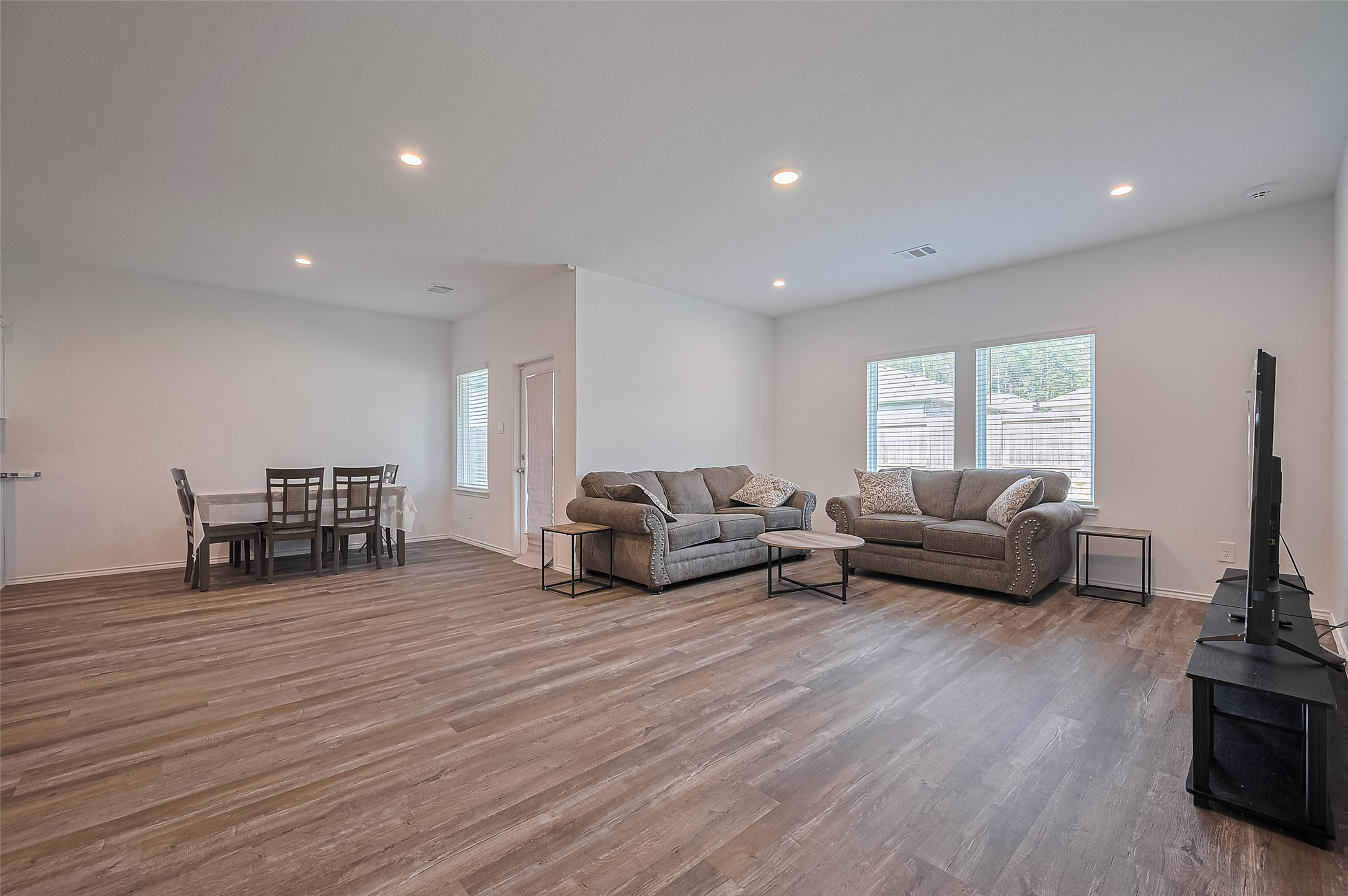 40434 Basalt Elm Road Magnolia, TX 77354 - Photo 8 of 41 a living room with furniture and a wooden floor