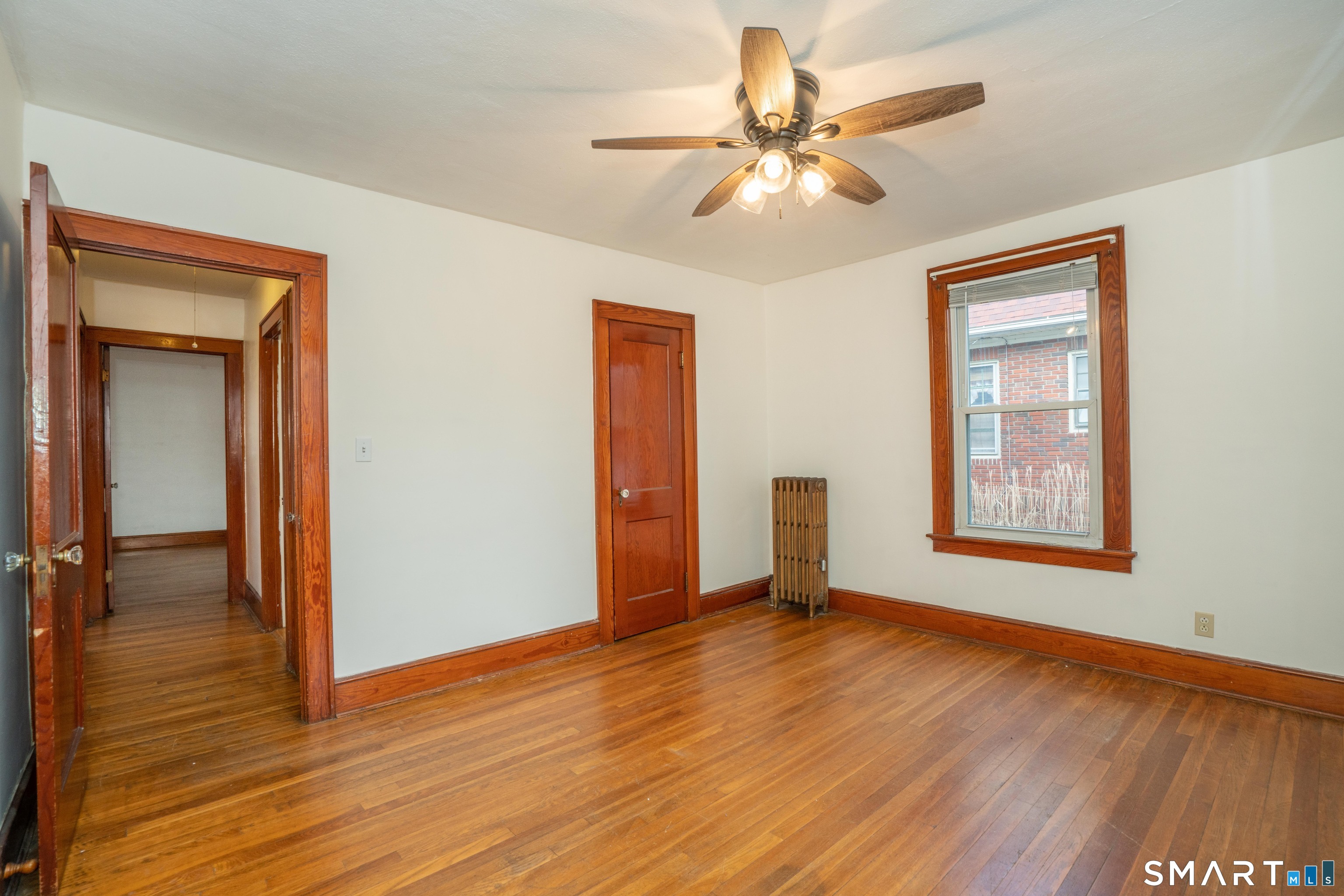 99 Queen Street Bristol, CT 06010 - Photo 12 of 39 Hardwood floors and a ceiling fan