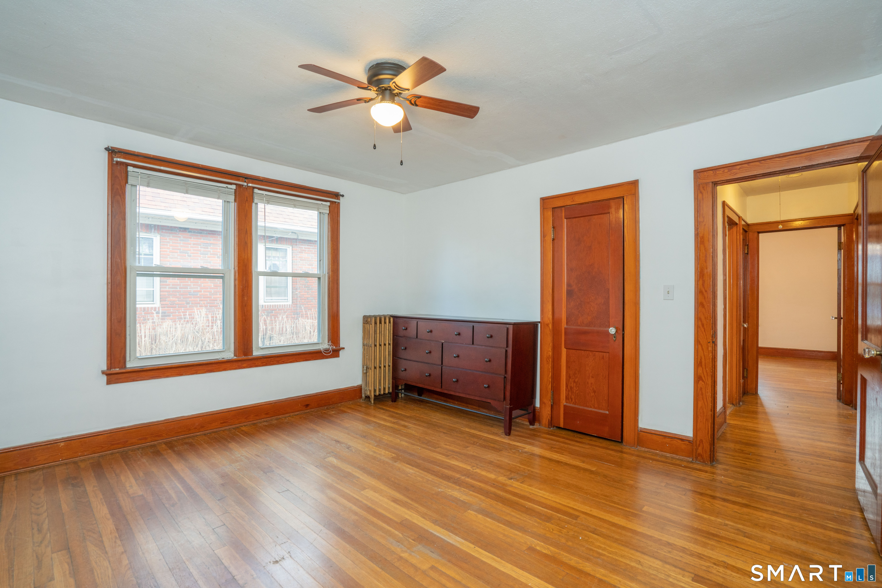 99 Queen Street Bristol, CT 06010 - Photo 14 of 39 Hardwood floors and a ceiling fan
