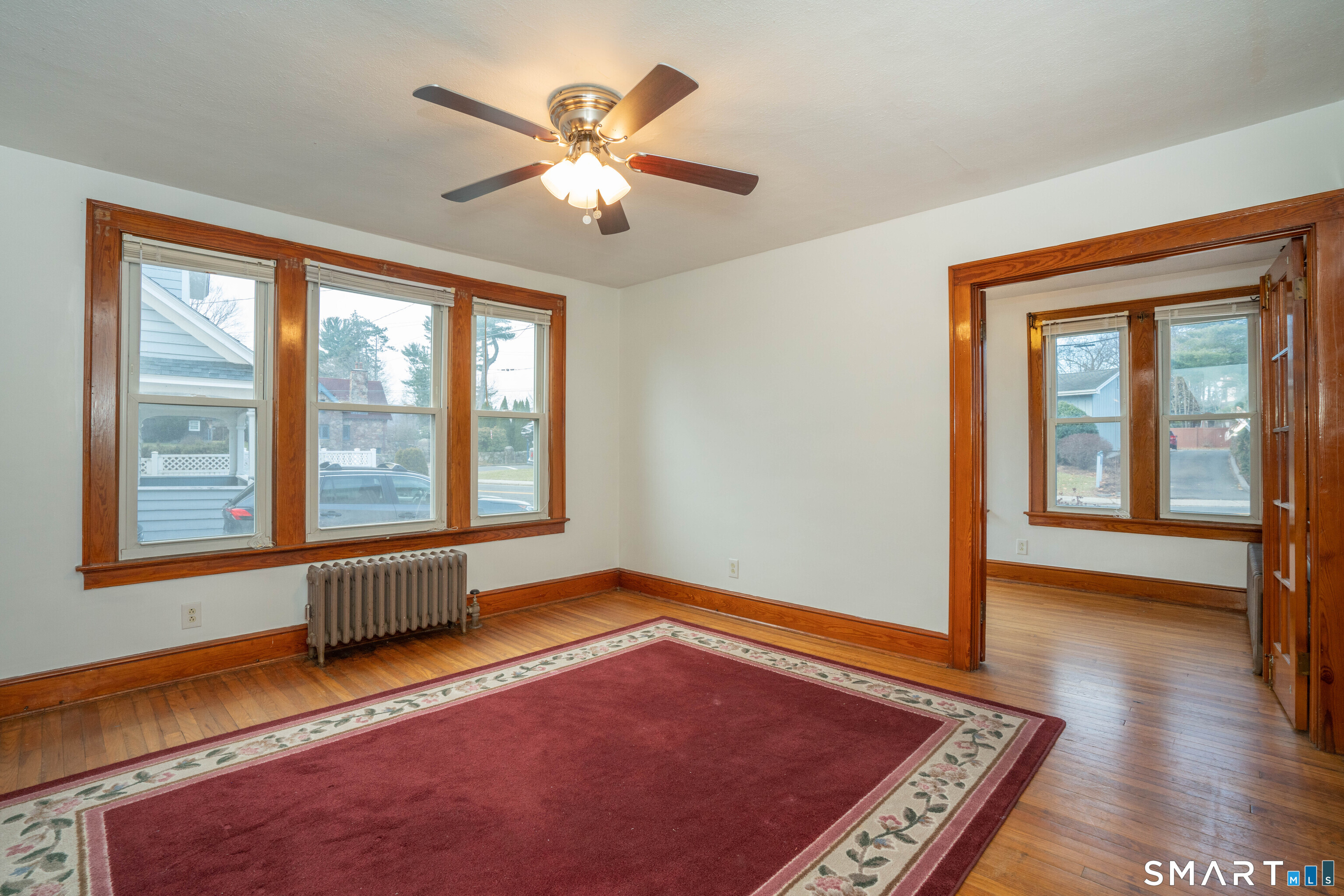 99 Queen Street Bristol, CT 06010 - Photo 6 of 39 Tons of natural light, hardwood floors and a ceiling fan