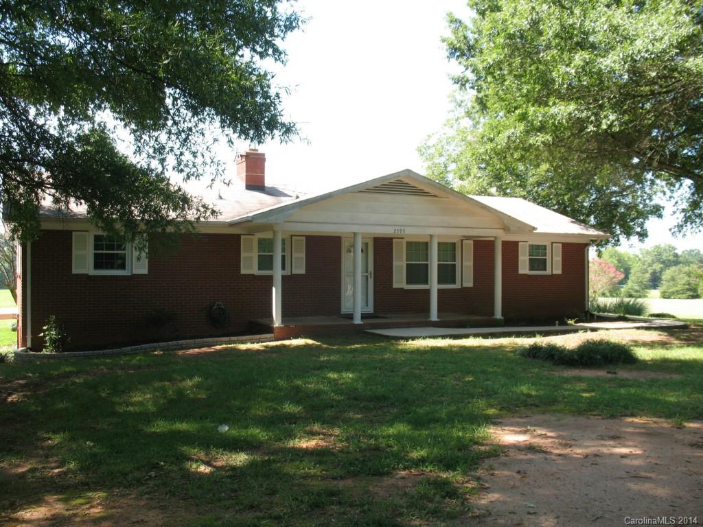 2595 Deal Road Mooresville, NC 28115 - Photo 1 of 19 a front view of a house with a garden