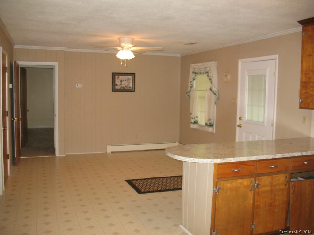 2595 Deal Road Mooresville, NC 28115 - Photo 3 of 19 wooden floor with a sink and a mirror