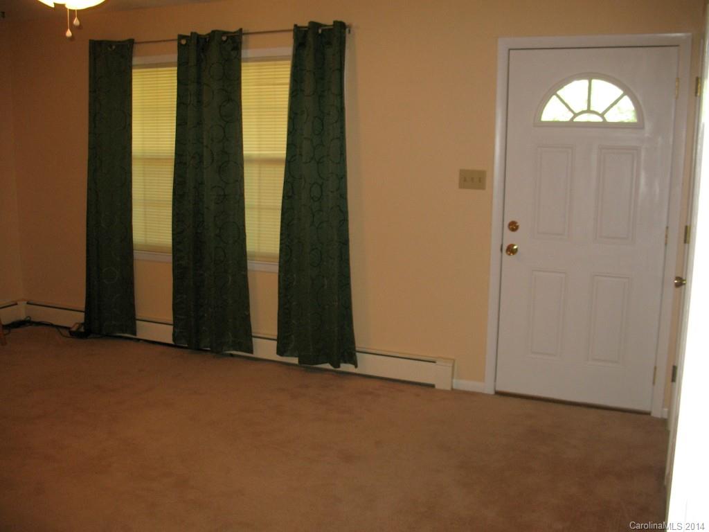 2595 Deal Road Mooresville, NC 28115 - Photo 4 of 19 an empty room with windows