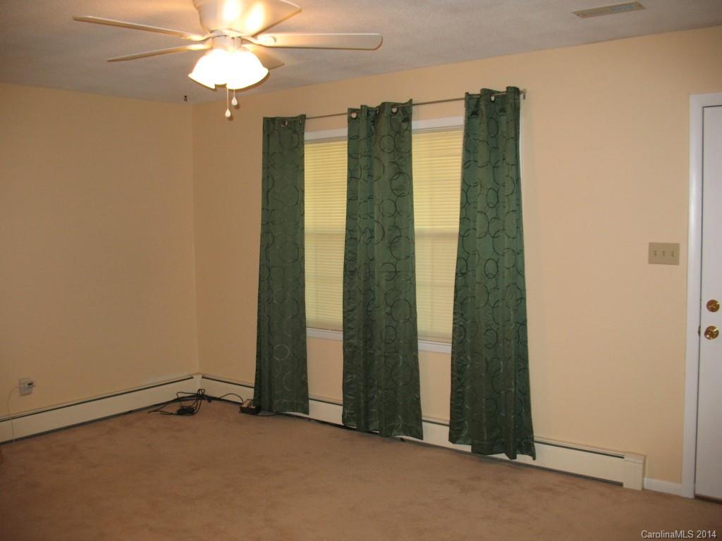 2595 Deal Road Mooresville, NC 28115 - Photo 5 of 19 an empty room with windows and closet