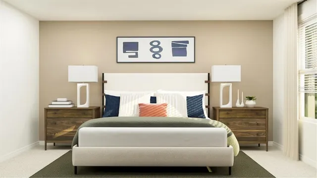 a bedroom with a bed and a lamp on table