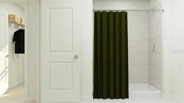 a bathroom with a shower and a mirror