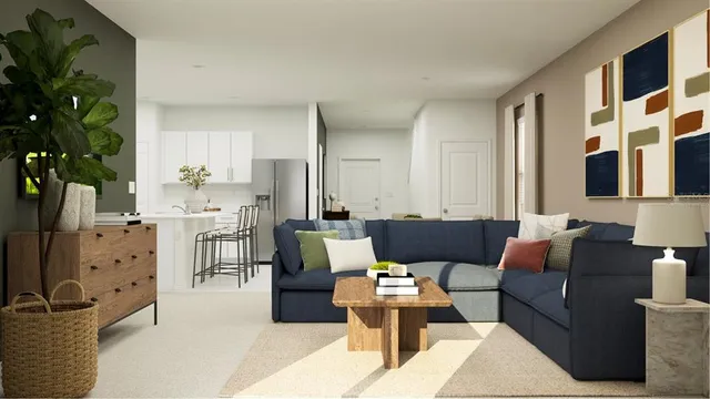 a living room with furniture and a potted plant