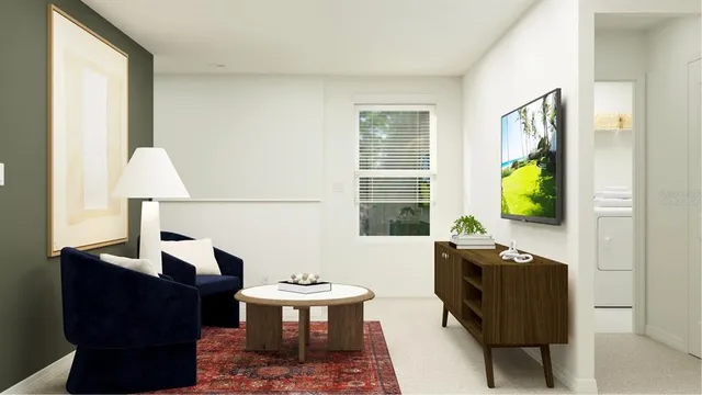 a living room with furniture and a window