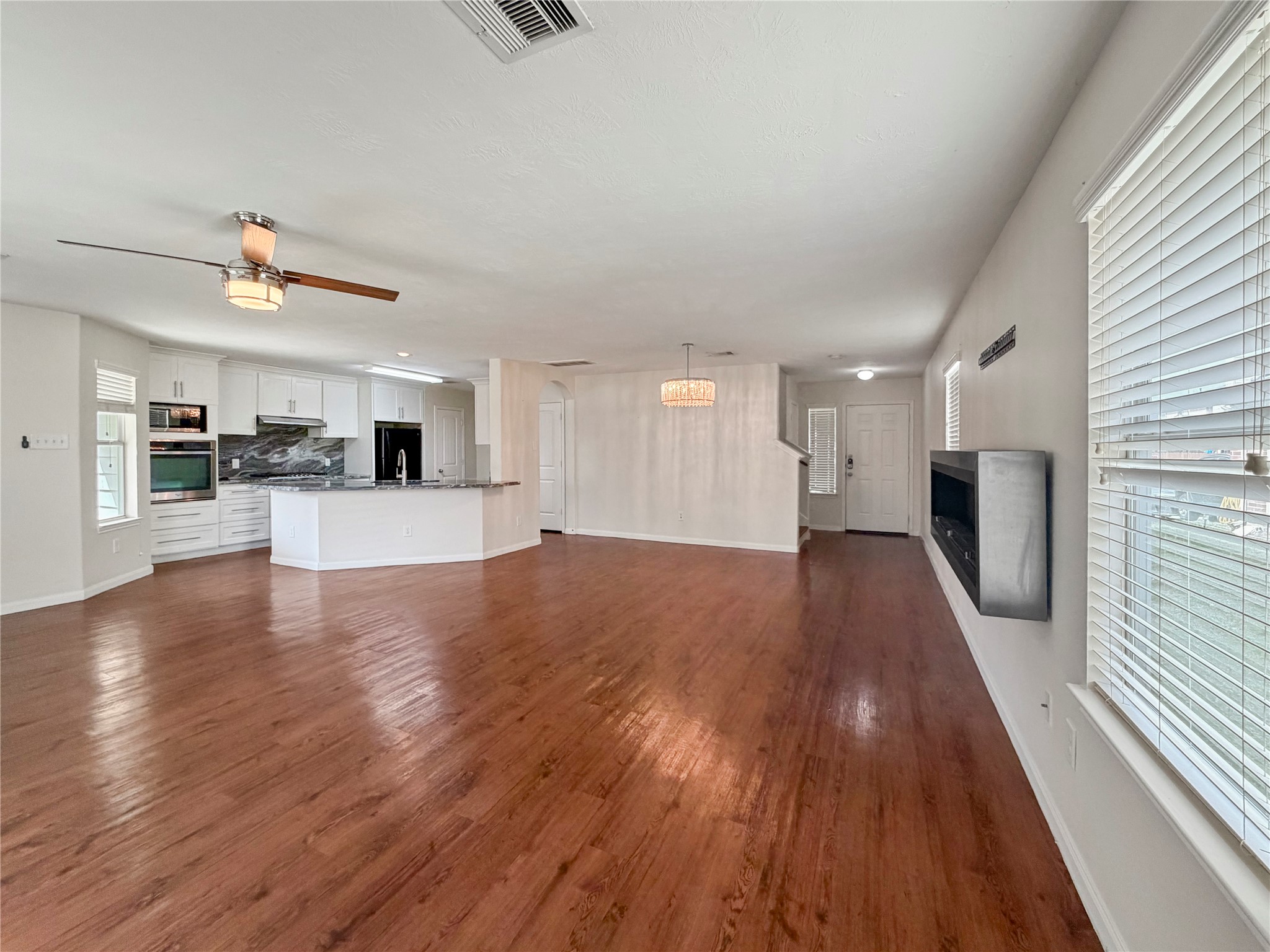3542 Maris Way Humble, TX 77338 - Photo 5 of 21 a view of a kitchen with a sink and microwave