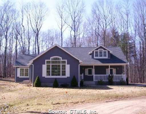 137 Valentine Road Pomfret, CT 06259 - Photo 1 of 1 a front view of a house with a yard covered in snow