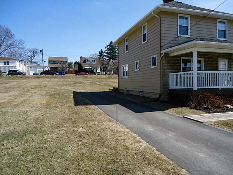 1408 Darlington Road Beaver Falls, PA 15010 - Photo 22 of 24 Exterior Front. Plenty of parking and a large side yard.