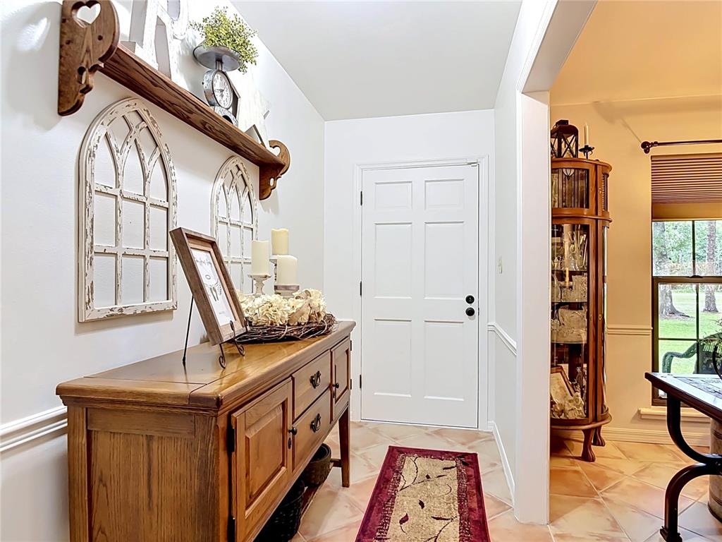 1395 Maytown Road Osteen, FL 32764 - Photo 10 of 65 a view of an entryway with wooden floor