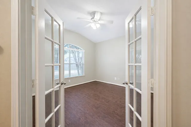 a view of an empty room with a window