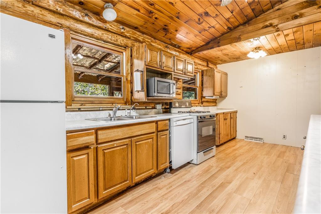 103 Guillard Road Prospect, PA 16052 - Photo 11 of 25 a kitchen with stainless steel appliances granite countertop a stove sink and microwave