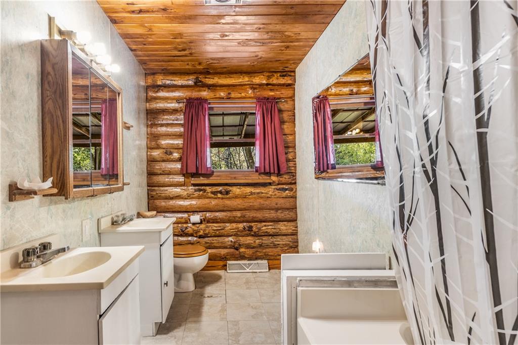 103 Guillard Road Prospect, PA 16052 - Photo 18 of 25 a bathroom with a sink and a mirror
