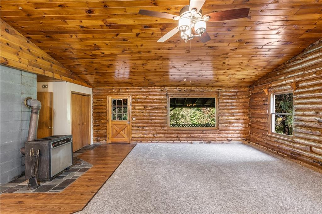 103 Guillard Road Prospect, PA 16052 - Photo 6 of 25 a view of a hallway with wooden floor and a fireplace