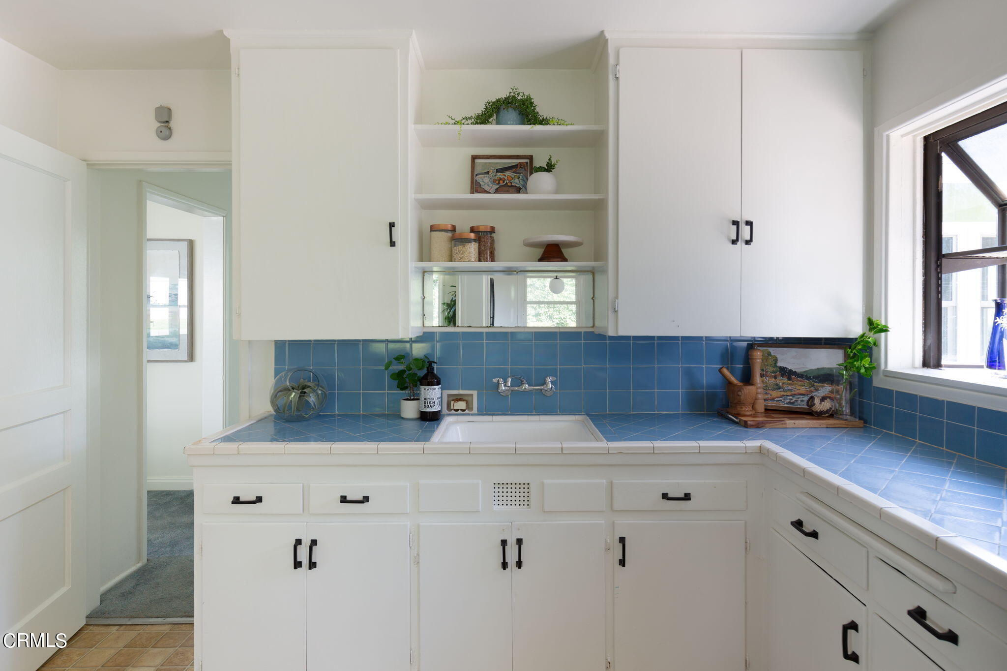 3565 McNally Avenue Altadena, CA 91001 - Photo 8 of 33 a kitchen with granite countertop white cabinets and a wooden floor