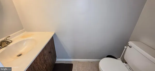 a bathroom with a sink toilet and tub