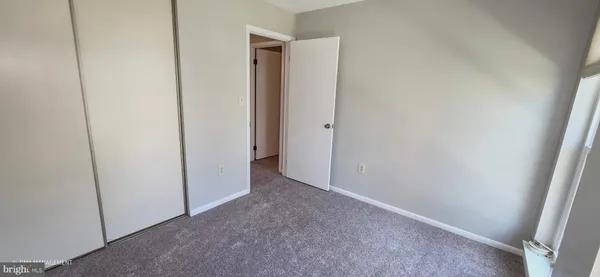 a view of hallway with closet