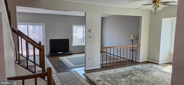 a view of an entryway with wooden floor