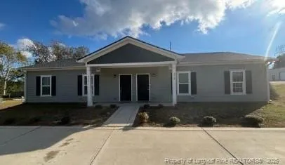 a front view of a house with yard