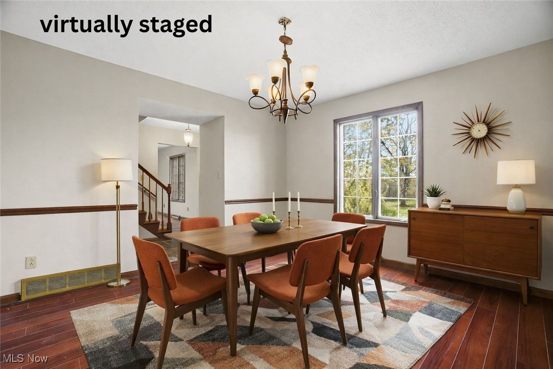 11710 Butternut Road Chardon, OH 44024 - Photo 15 of 48 Virtually staged Dining space with dark wood-type flooring, a chandelier