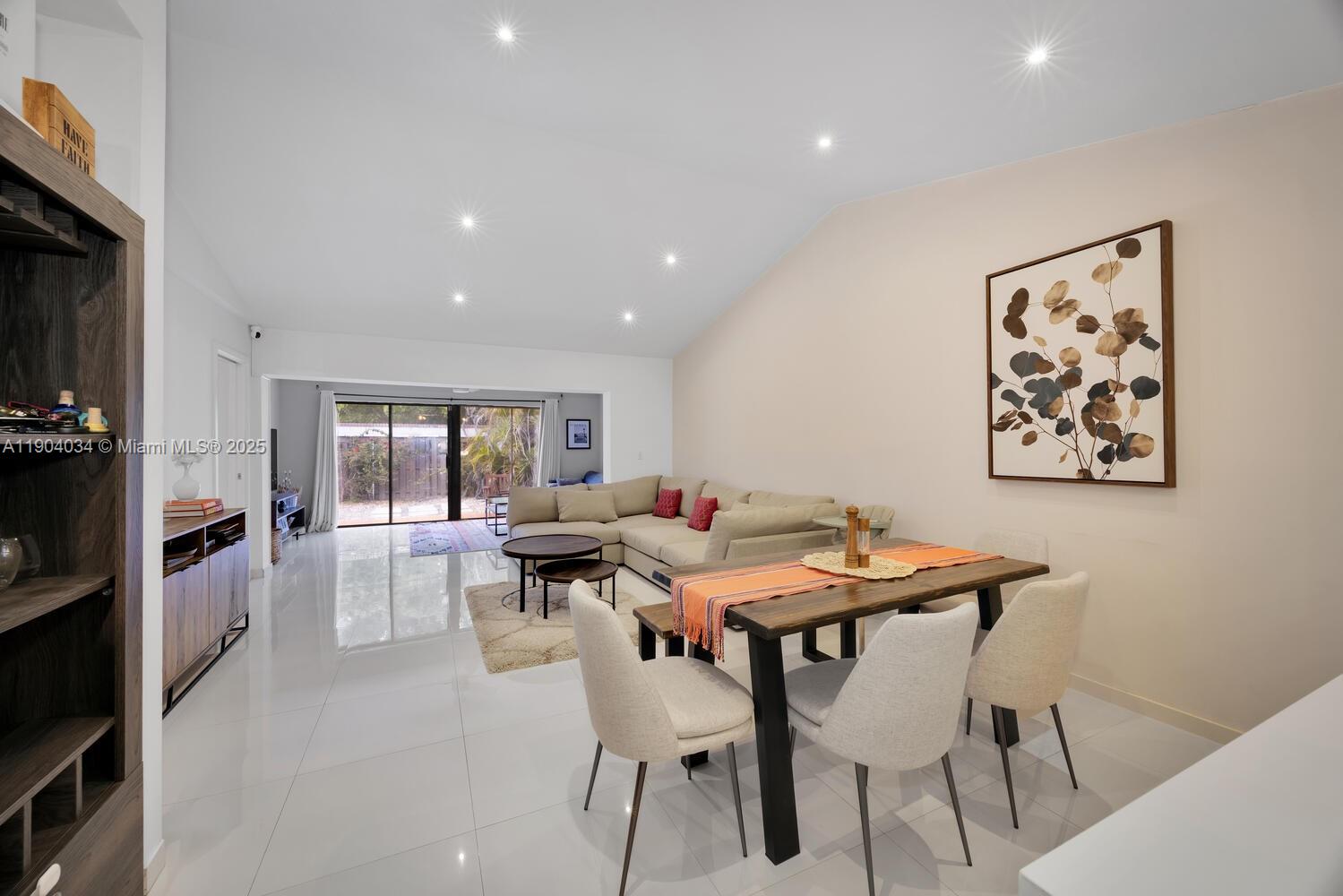 8596 Southwest 115th Place Miami, FL 33173 - Photo 11 of 39 a view of a dining room with furniture