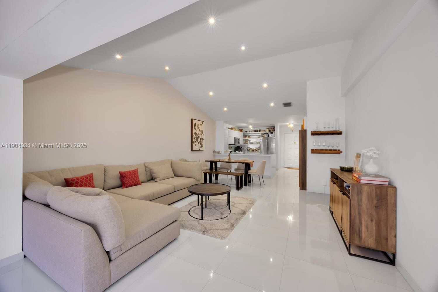 8596 Southwest 115th Place Miami, FL 33173 - Photo 15 of 39 a living room with furniture and a table