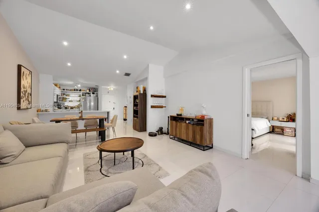 a living room with furniture and a table