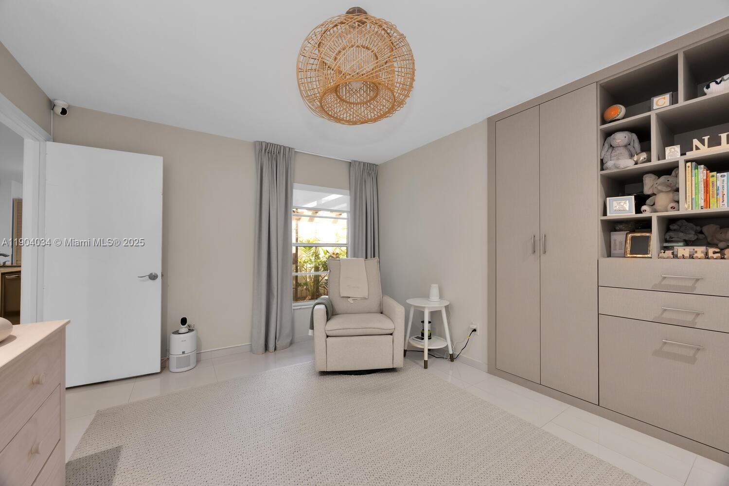 8596 Southwest 115th Place Miami, FL 33173 - Photo 27 of 39 a living room with furniture and a window