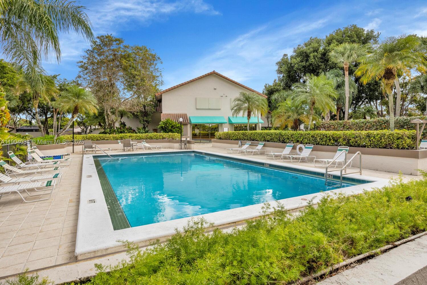 8596 Southwest 115th Place Miami, FL 33173 - Photo 39 of 39 a view of a house with swimming pool and sitting area