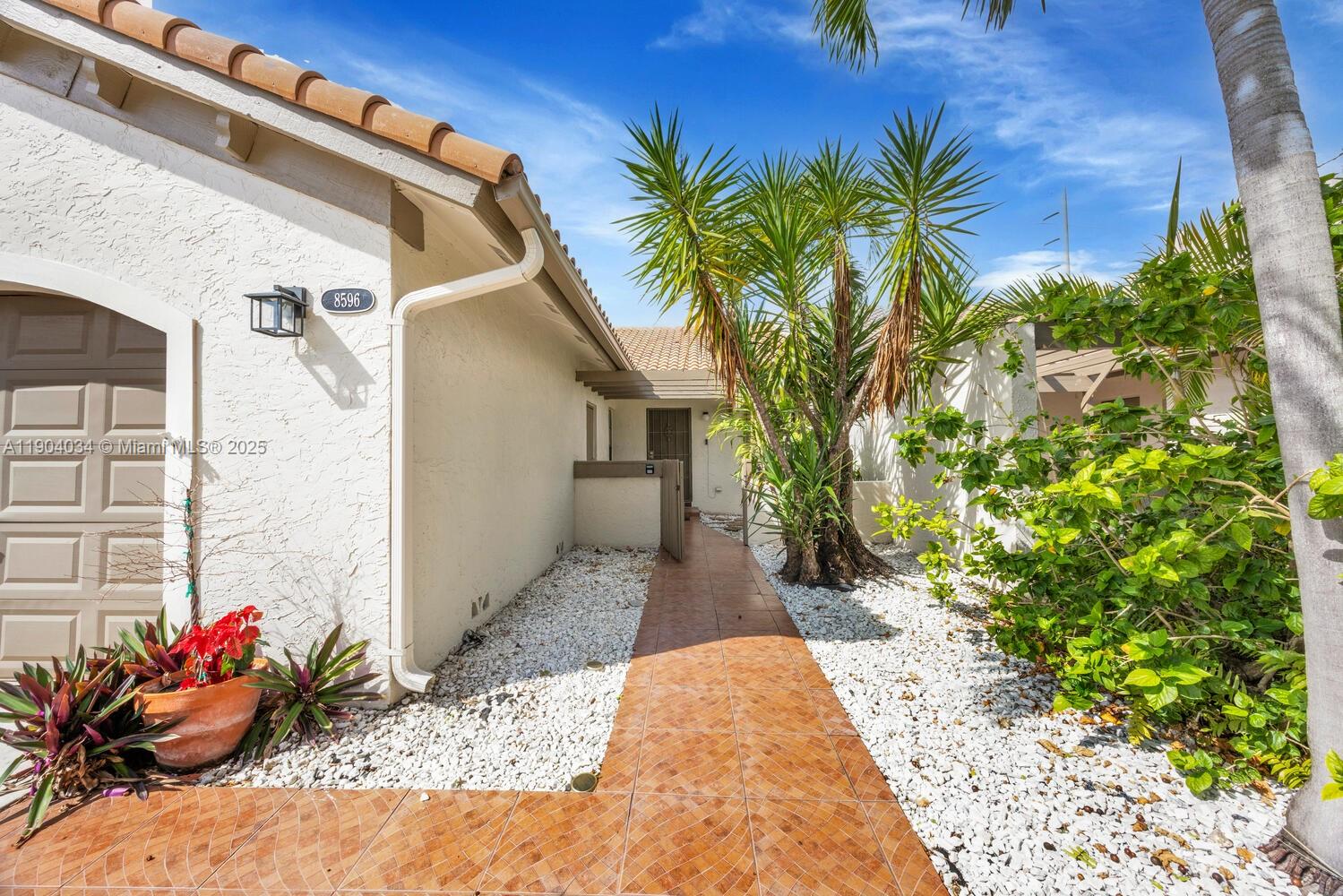 8596 Southwest 115th Place Miami, FL 33173 - Photo 4 of 39 a view of a entryway front of house