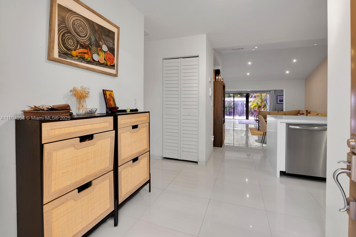 8596 Southwest 115th Place Miami, FL 33173 - Photo 6 of 39 a kitchen with stainless steel appliances granite countertop a refrigerator and a stove top oven