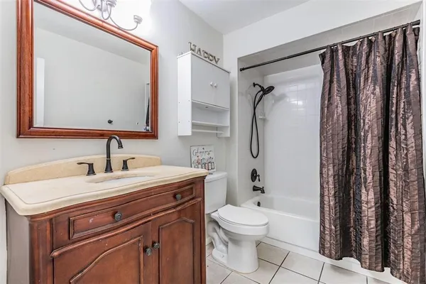 a bedroom with a bed and cabinets