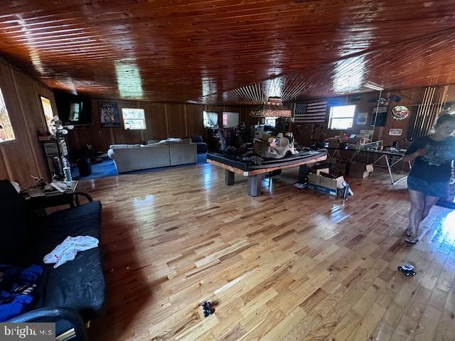 4402 Allegheny Road Manns Choice, PA 15550 - Photo 22 of 25 a living room with lots of furniture and gym equipment