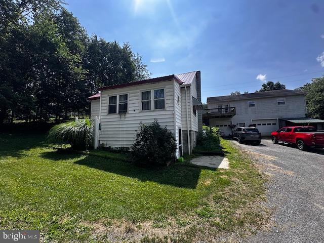 4402 Allegheny Road Manns Choice, PA 15550 - Photo 3 of 25 a house view with a garden space