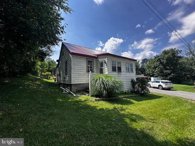4402 Allegheny Road Manns Choice, PA 15550 - Photo 5 of 25 a view of a house with a yard and sitting area