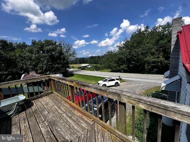 4402 Allegheny Road Manns Choice, PA 15550 - Photo 9 of 25 a view of a balcony with wooden floor and a forest