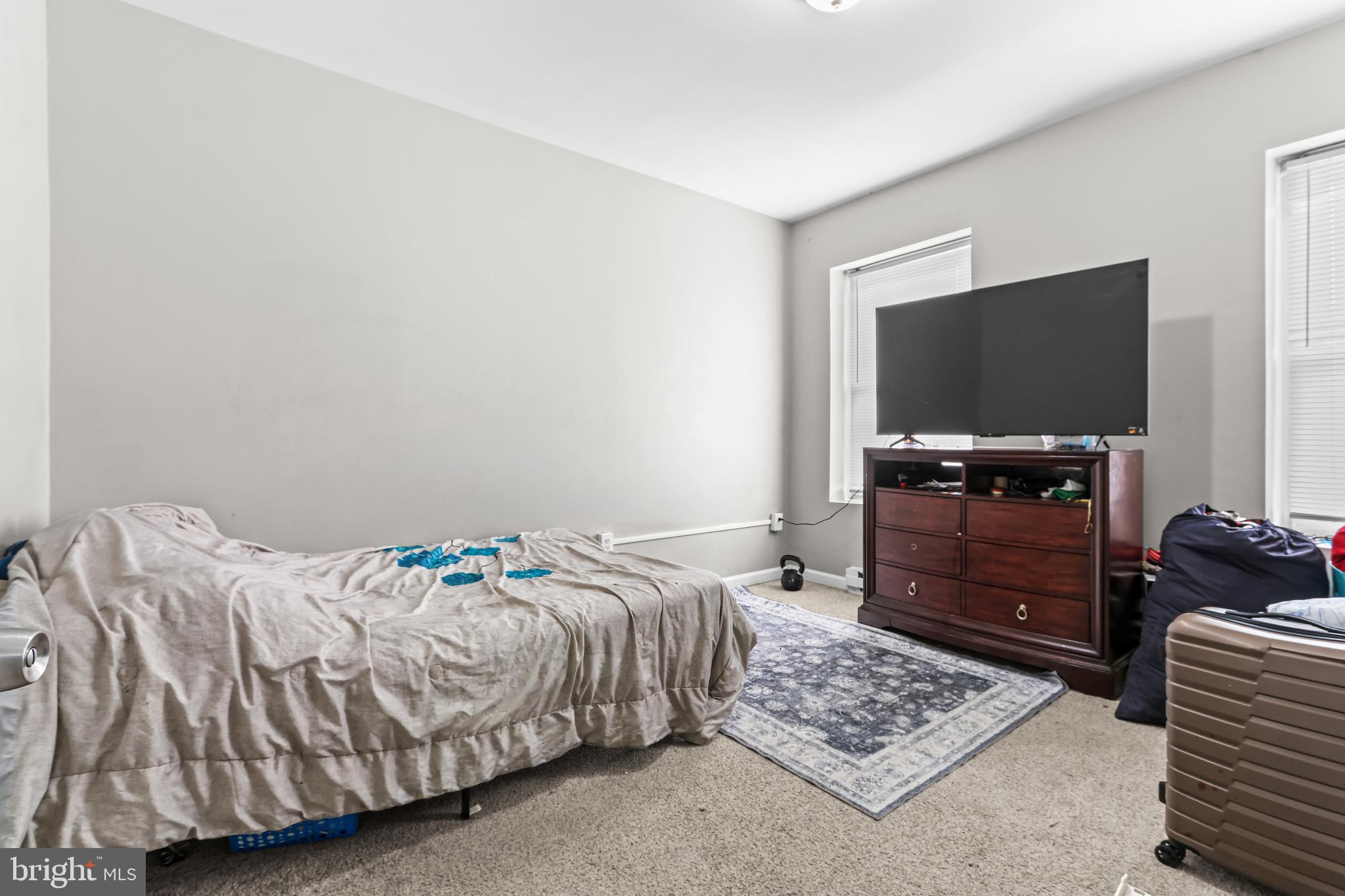 12 South Front Street Coplay, PA 18037 - Photo 30 of 42 a bedroom with a bed and a flat screen tv