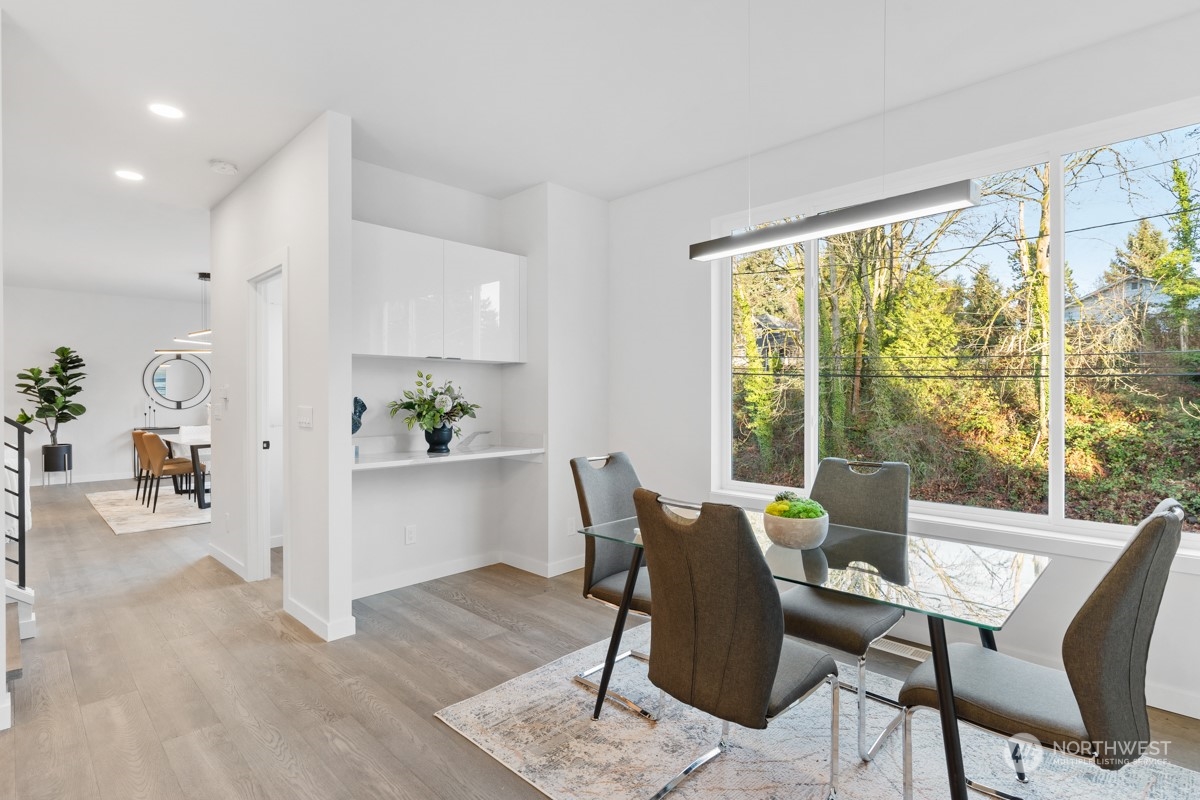7511 Dumar Way Southwest Seattle, WA 98106 - Photo 12 of 35 a view of a dining room with furniture window and wooden floor