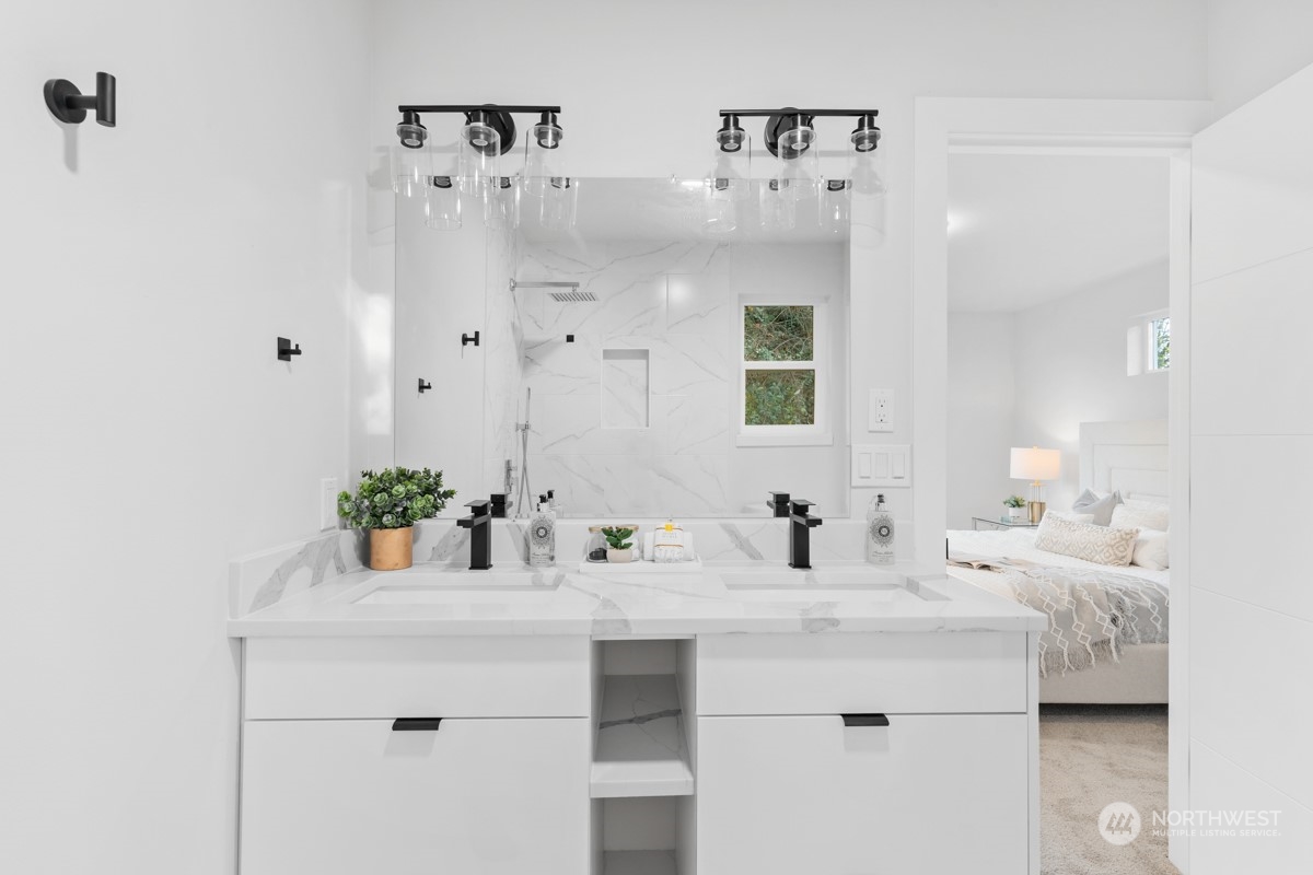 7511 Dumar Way Southwest Seattle, WA 98106 - Photo 19 of 35 a bathroom with a sink vanity and a mirror