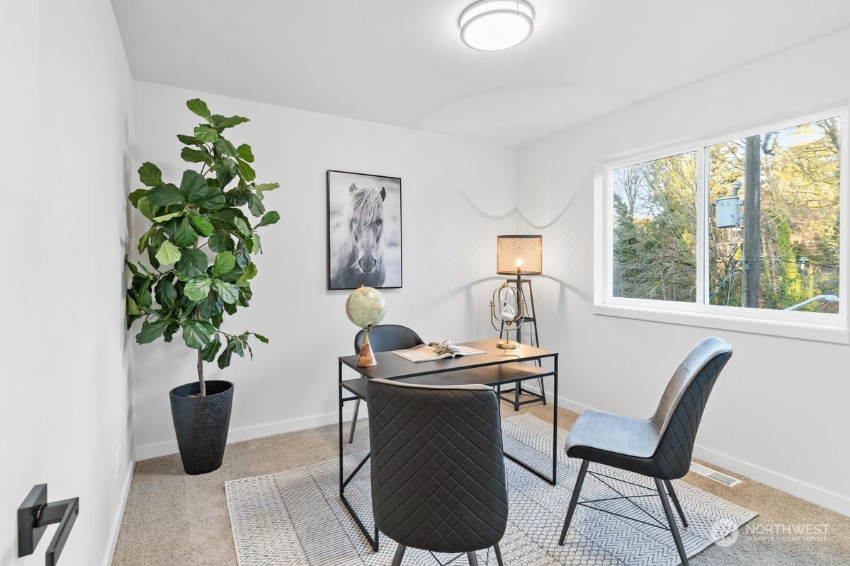 7511 Dumar Way Southwest Seattle, WA 98106 - Photo 24 of 35 a dining room with furniture and potted plant
