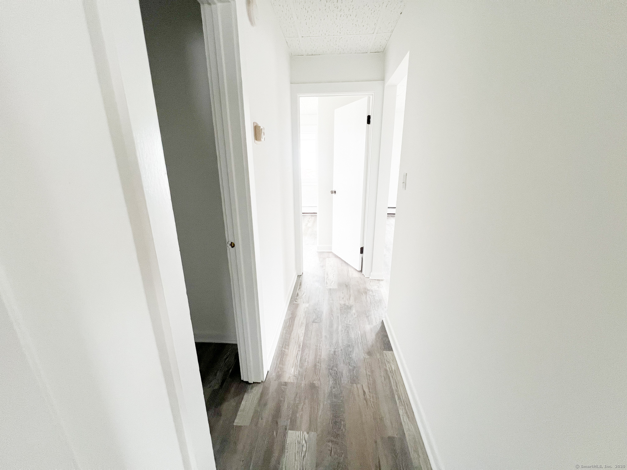 12 Blackall Road, Unit 1 Milford, CT 06460 - Photo 6 of 9 a view of a hallway with wooden floor