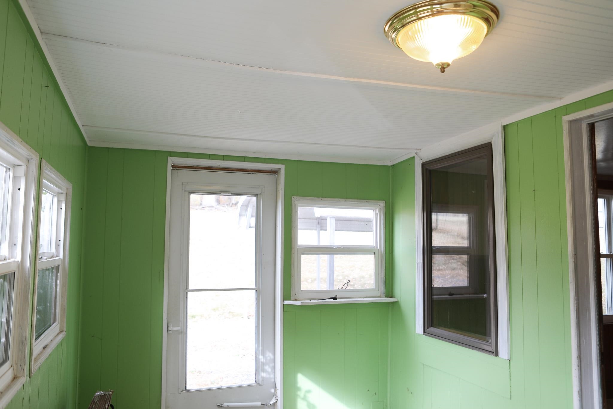 570 Mt Solon Road Mount Solon, VA 22843 - Photo 14 of 36 a view of an empty room with a window and a kitchen
