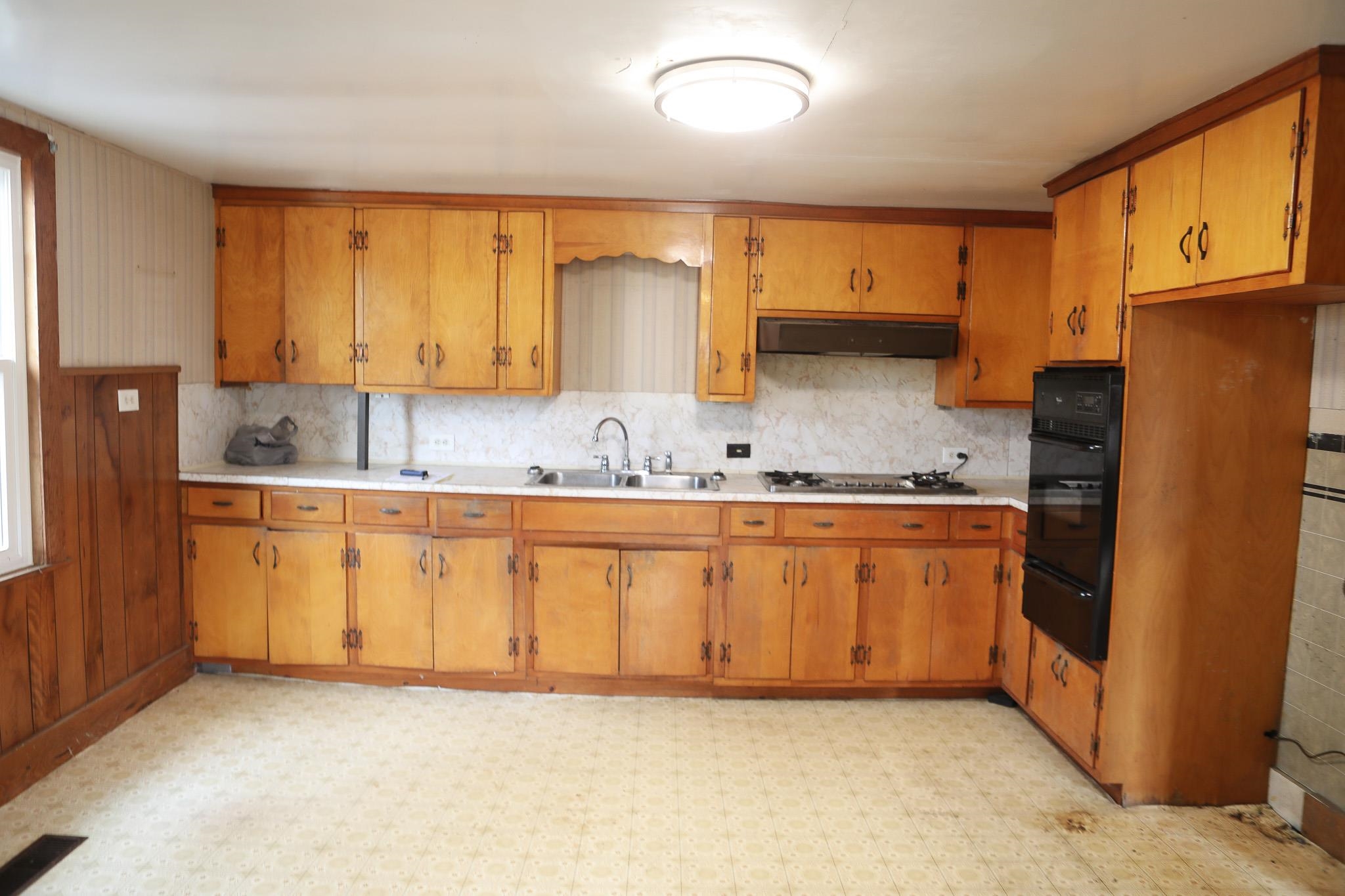 570 Mt Solon Road Mount Solon, VA 22843 - Photo 17 of 36 a kitchen with granite countertop a refrigerator stove top oven a sink and dishwasher