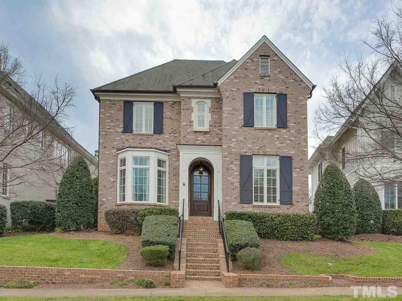 507 Guilford Circle Raleigh, NC 27608 - Photo 1 of 26 a front view of a house with garden