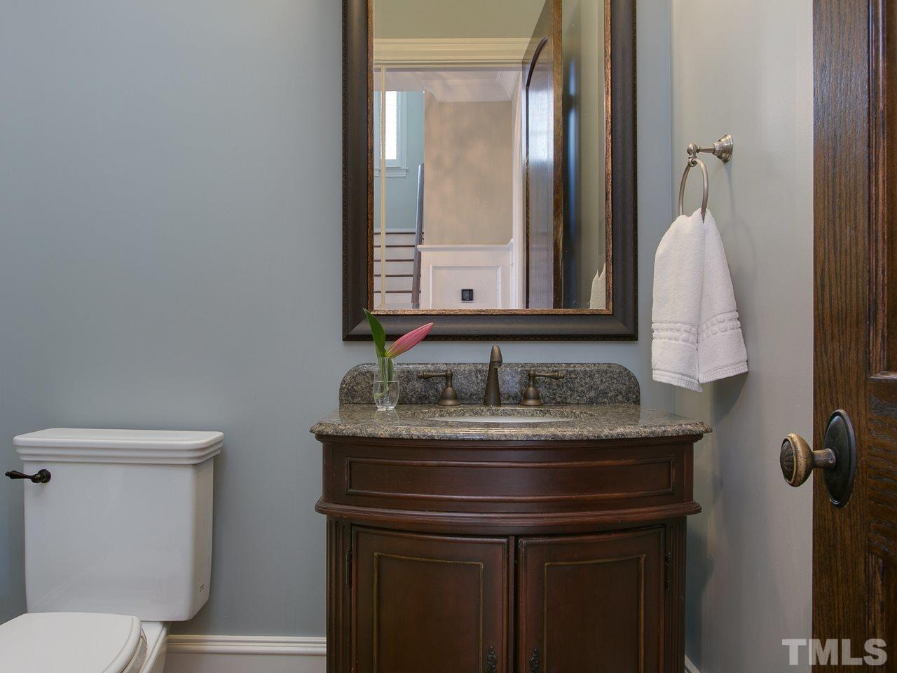 507 Guilford Circle Raleigh, NC 27608 - Photo 12 of 26 a bathroom with a sink and a toilet
