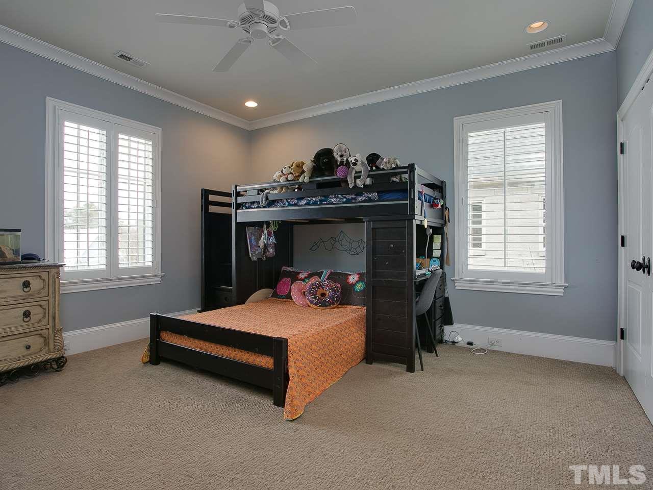 507 Guilford Circle Raleigh, NC 27608 - Photo 17 of 26 a bedroom with bed and windows